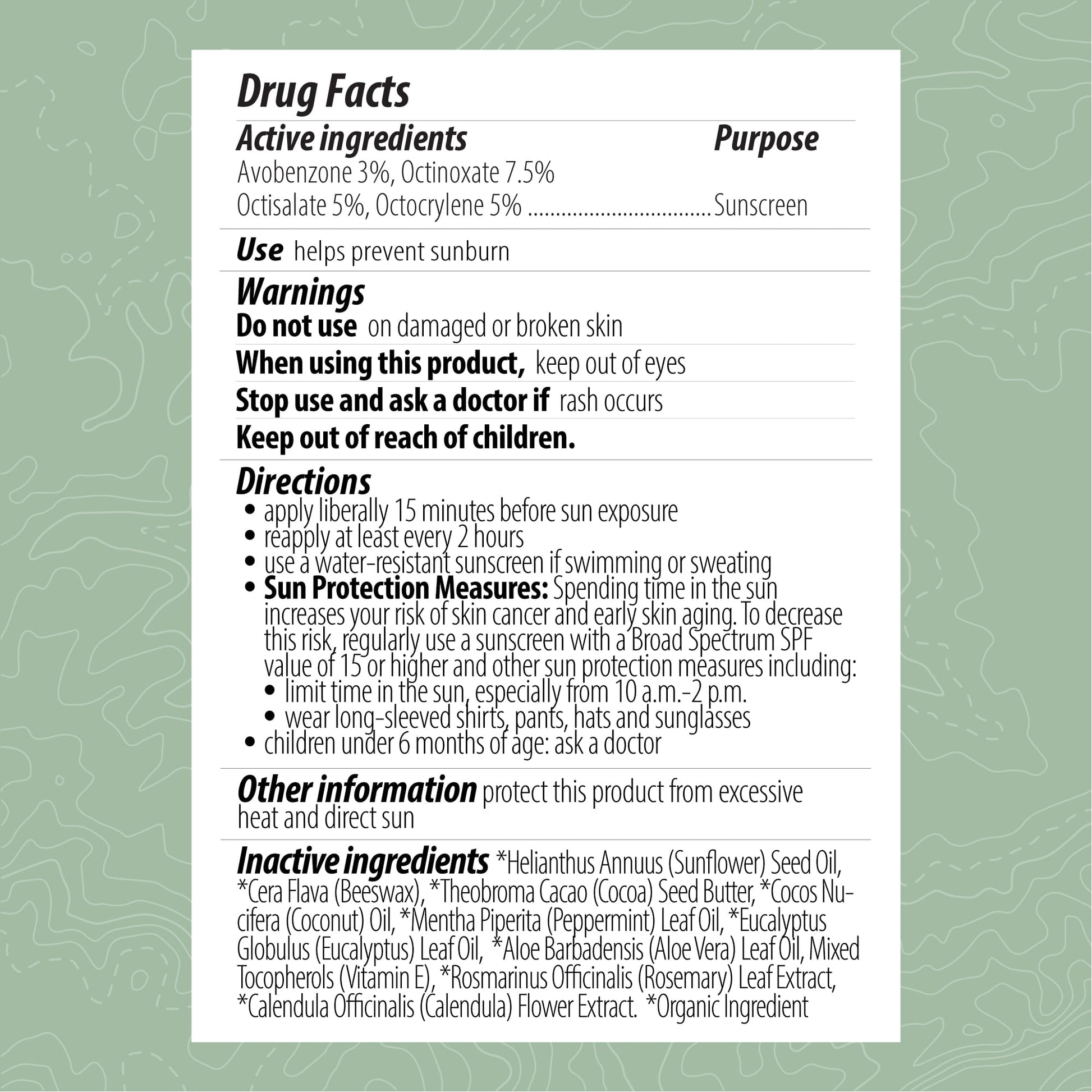 Drug facts label for a sunscreen product on a green background