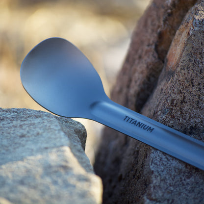 Titanium spoon on a rock with a natural background
