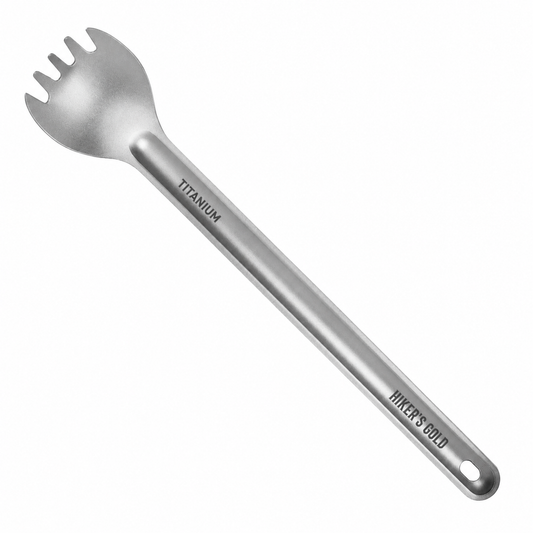 A titanium spork with a long handle, featuring the engraved words 'TITANIUM' and 'HIKER'S GOLD', shown on a plain white background.
